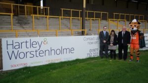 Hartley & Worstenholme advertising hording at Castleford Tigers Mend-A-Hose Jungle